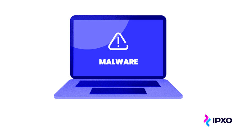 A malware warning on the laptop's screen.